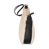 Kangmar is a beautiful shearling handbag which is perfect for carrying your essentials with you, it comes with detachable shoulder strap in skin. Top double zipped closure. Top handle in soft skin with hardware in gold. Adjustable and detachable shoulder strap in leather, 15 mm wide.  Satin lining and flat zipped inner pocket Item comes with a branded dust bag. Embossed Lovelies logo inside the bag.  Gold-toned hardware Measurements W36 X D5 X H20 cm 100 % Australian shearling 