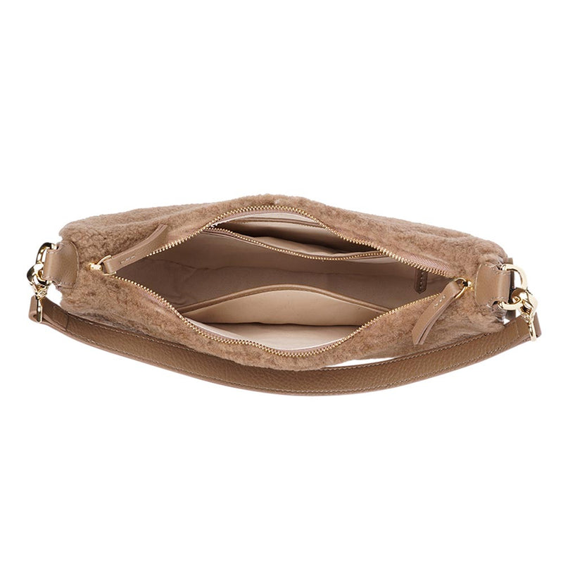 Kangmar is a beautiful shearling handbag which is perfect for carrying your essentials with you, it comes with detachable shoulder strap in skin. Top double zipped closure. Top handle in soft skin with hardware in gold. Adjustable and detachable shoulder strap in leather, 15 mm wide.  Satin lining and flat zipped inner pocket Item comes with a branded dust bag. Embossed Lovelies logo inside the bag.  Gold-toned hardware Measurements W36 X D5 X H20 cm 100 % Australian shearling 