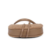 Kangmar is a beautiful shearling handbag which is perfect for carrying your essentials with you, it comes with detachable shoulder strap in skin. Top double zipped closure. Top handle in soft skin with hardware in gold. Adjustable and detachable shoulder strap in leather, 15 mm wide.  Satin lining and flat zipped inner pocket Item comes with a branded dust bag. Embossed Lovelies logo inside the bag.  Gold-toned hardware Measurements W36 X D5 X H20 cm 100 % Australian shearling 
