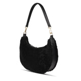 Kangmar is a beautiful shearling handbag which is perfect for carrying your essentials with you, it comes with detachable shoulder strap in skin. Top double zipped closure. Top handle in soft skin with hardware in gold. Adjustable and detachable shoulder strap in leather, 15 mm wide.  Satin lining and flat zipped inner pocket Item comes with a branded dust bag. Embossed Lovelies logo inside the bag.  Gold-toned hardware Measurements W36 X D5 X H20 cm 100 % Australian shearling 