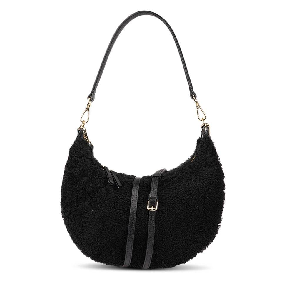 Kangmar is a beautiful shearling handbag which is perfect for carrying your essentials with you, it comes with detachable shoulder strap in skin. Top double zipped closure. Top handle in soft skin with hardware in gold. Adjustable and detachable shoulder strap in leather, 15 mm wide.  Satin lining and flat zipped inner pocket Item comes with a branded dust bag. Embossed Lovelies logo inside the bag.  Gold-toned hardware Measurements W36 X D5 X H20 cm 100 % Australian shearling 