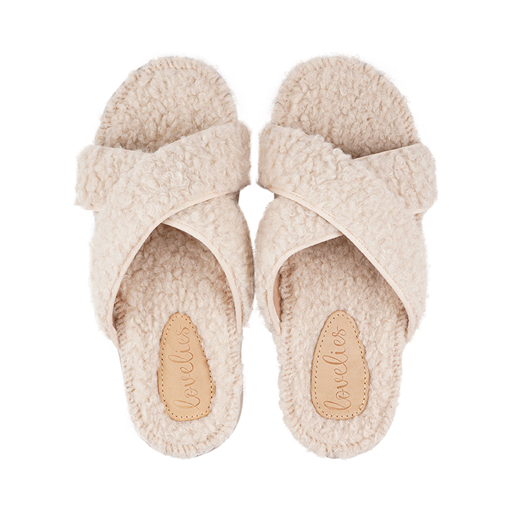 Lovelies lounge slippers are the essence of comfortability. When you’re in the need of surrounding your feet in soft and warm slippers, Lovelies lounge slippers are the answer. With soft and durable soles, fine wool and a gorgeous design, you’ll never want to wear any other home-shoe to make you feel at ease.  Enjoy your Lovelies!  See our Size Guide  Material:  Outsole / Insole : Rubber  Footbed: Curly faux fur Lining: 80% Wool – 20% polyester Upper: Curly faux fur