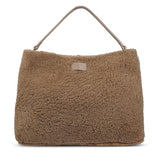 Mainling is a tribute to craftsmanship and the handmade, this large and very soft bag comes in curly shearling and with beautiful leather details. * Top double zipped closure. * Top handle in soft skin with hardware in gold. * Adjustable and detachable shoulder strap in leather, 15 mm wide. * Satin lining and flat zipped inner pocket * Item comes with a branded dust bag. * Embossed Lovelies logo on the front. * Gold-toned hardware * Messurements W40 X D10 X H30 cm * 100 % Australian shearling