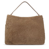 Mainling is a tribute to craftsmanship and the handmade, this large and very soft bag comes in curly shearling and with beautiful leather details. * Top double zipped closure. * Top handle in soft skin with hardware in gold. * Adjustable and detachable shoulder strap in leather, 15 mm wide. * Satin lining and flat zipped inner pocket * Item comes with a branded dust bag. * Embossed Lovelies logo on the front. * Gold-toned hardware * Messurements W40 X D10 X H30 cm * 100 % Australian shearling