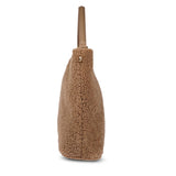 Mainling is a tribute to craftsmanship and the handmade, this large and very soft bag comes in curly shearling and with beautiful leather details. * Top double zipped closure. * Top handle in soft skin with hardware in gold. * Adjustable and detachable shoulder strap in leather, 15 mm wide. * Satin lining and flat zipped inner pocket * Item comes with a branded dust bag. * Embossed Lovelies logo on the front. * Gold-toned hardware * Messurements W40 X D10 X H30 cm * 100 % Australian shearling