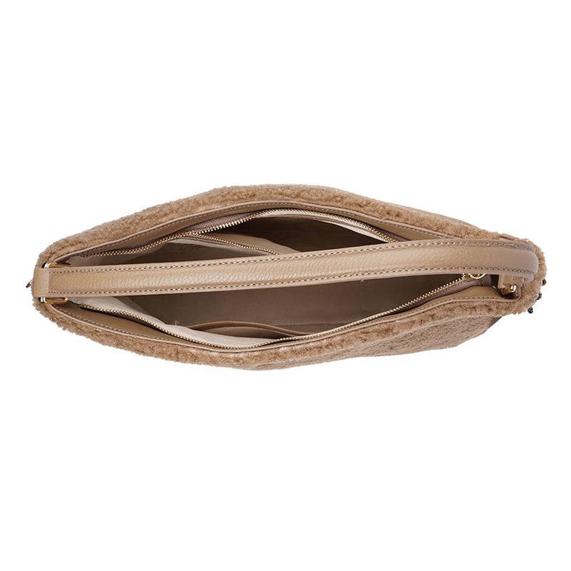 Mainling is a tribute to craftsmanship and the handmade, this large and very soft bag comes in curly shearling and with beautiful leather details. * Top double zipped closure. * Top handle in soft skin with hardware in gold. * Adjustable and detachable shoulder strap in leather, 15 mm wide. * Satin lining and flat zipped inner pocket * Item comes with a branded dust bag. * Embossed Lovelies logo on the front. * Gold-toned hardware * Messurements W40 X D10 X H30 cm * 100 % Australian shearling