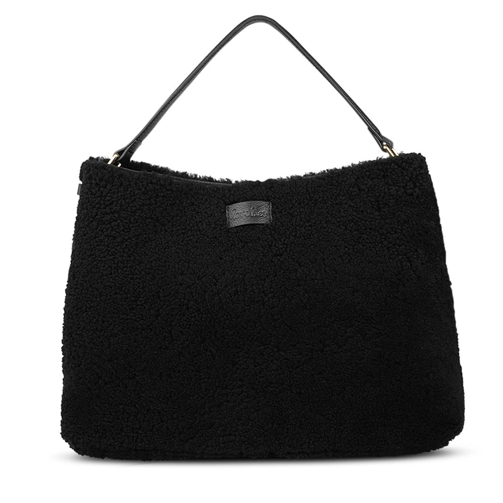 Mainling is a tribute to craftsmanship and the handmade, this large and very soft bag comes in curly shearling and with beautiful leather details. * Top double zipped closure. * Top handle in soft skin with hardware in gold. * Adjustable and detachable shoulder strap in leather, 15 mm wide. * Satin lining and flat zipped inner pocket * Item comes with a branded dust bag. * Embossed Lovelies logo on the front. * Gold-toned hardware * Messurements W40 X D10 X H30 cm * 100 % Australian shearling