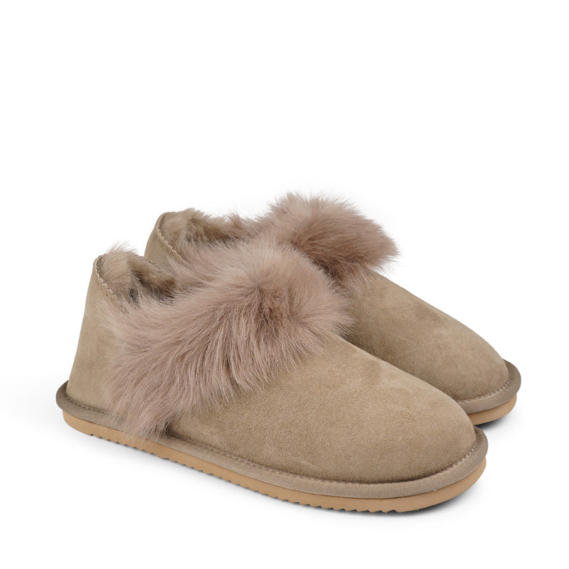 Soft and cosy shearling slippers with heel cap  Lovelies shearling slippers are the essence of comfortability. When you’re in the need of surrounding your feet in soft and warm slippers, Lovelies shearling slippers are the answer. With soft and durable soles, warm shearling and a gorgeous design, you’ll never want to wear any other home-shoe to make you feel at ease.