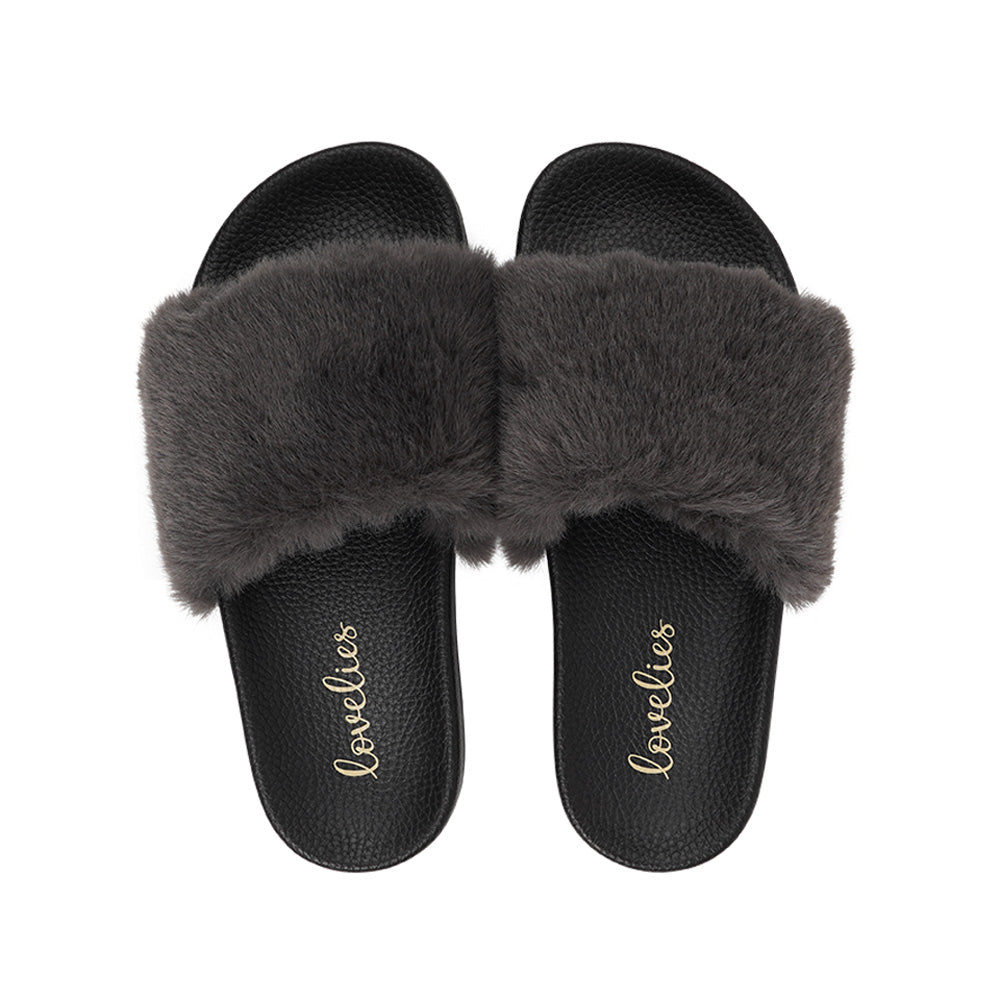 Lovelies Studio Denmark -  Exclusive slides with faux fur. Beautiful and feminine faux fur slides.  The soft rubber sole is light and very comfortable.   We are proud member of 1% for the planet  Enjoy your Lovelies  Material:  Sole : PU   Rubber Lining: Cotton Upper: Faux fur Summer slides in black and grey