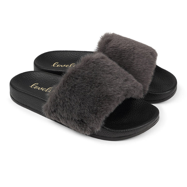 Lovelies Studio Denmark -  Exclusive slides with faux fur. Beautiful and feminine faux fur slides.  The soft rubber sole is light and very comfortable.   We are proud member of 1% for the planet  Enjoy your Lovelies  Material:  Sole : PU   Rubber Lining: Cotton Upper: Faux fur Summer slides in black and grey