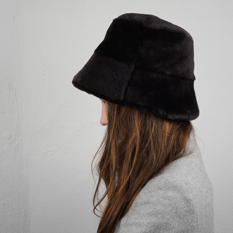 Lovelies Studio, the Danish brand. The cool Whitney shearling bucket hat is made of beautiful soft sheep fur both inside and outside.  Made with 100% Sheepskin. This incredible material balances form with function, offering a chic look with lightweight insulation in the winter and temperature regulation when spring arrives. 