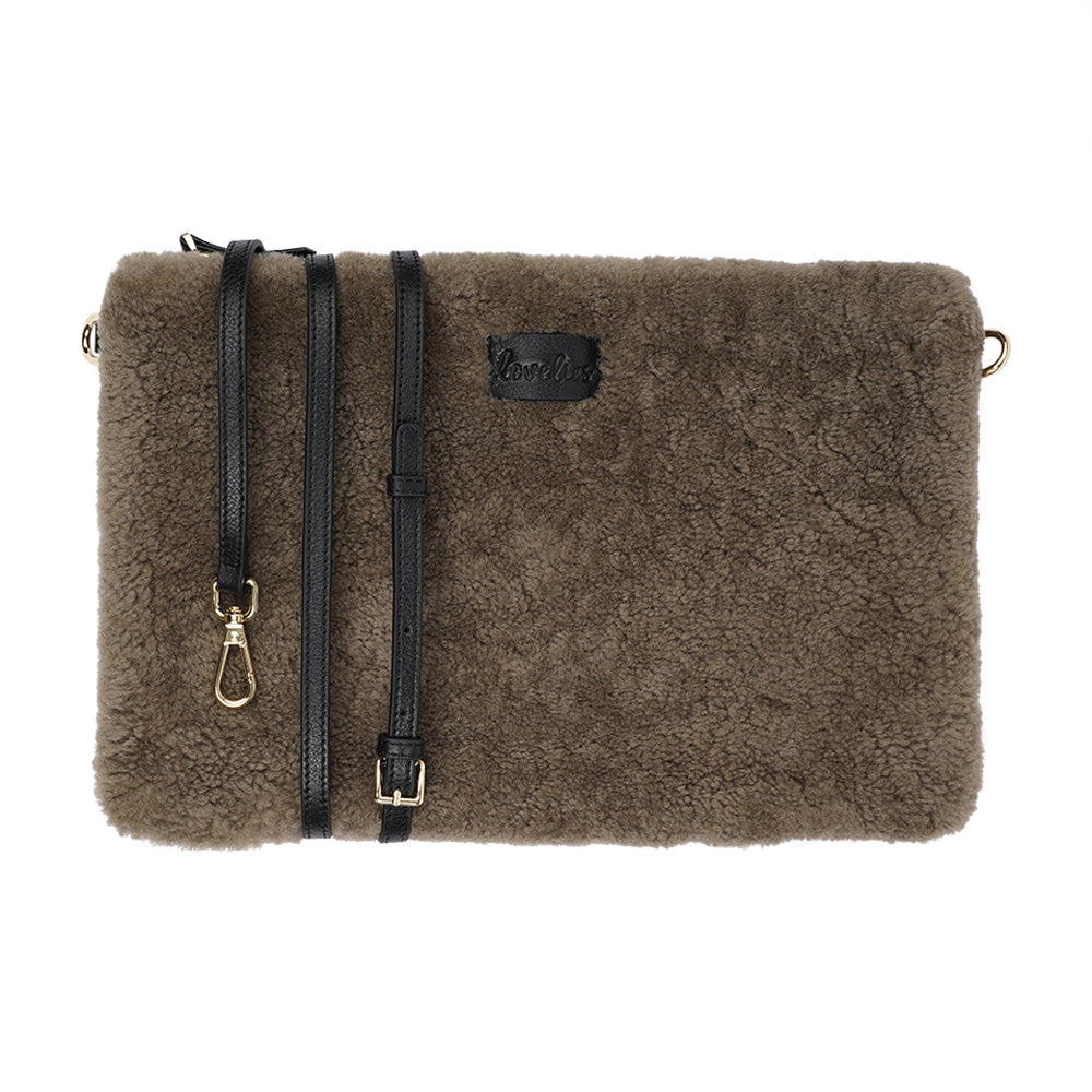 Lovelies Studio Wujii is a large shearling clutch which has room enough for your Ipad and notebooks . Wujii is hand made from the finest curly shearling from Australia.  Top zipped closing   Detachable wrist strap   Satin lining and flat zipped inner pocket   Item comes with a branded dust bag.   Embossed Lovelies logo on the front   Gold-toned hardware   Measurements W34 X D2 X H22 cm   100 % Australian curly shearling 