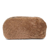 Lovelies Studio _ Wuttu is a mini clutch with a detachable wrist strap and is perfect for carrying your essentials with you. Wuttu is hand made from the finest curly shearling from Australia.   Top zipped closing   Detachable wrist strap   Satin lining and flat zipped inner pocket   Item comes with a branded dust bag.   Embossed Lovelies logo on the front   Gold-toned hardware   Measurements W26 X D2 X H12 cm   100 % Australian curly shearling 