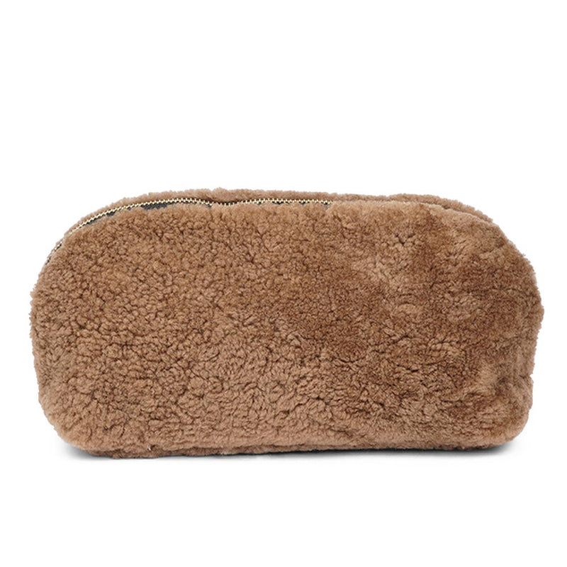 Lovelies Studio _ Wuttu is a mini clutch with a detachable wrist strap and is perfect for carrying your essentials with you. Wuttu is hand made from the finest curly shearling from Australia.   Top zipped closing   Detachable wrist strap   Satin lining and flat zipped inner pocket   Item comes with a branded dust bag.   Embossed Lovelies logo on the front   Gold-toned hardware   Measurements W26 X D2 X H12 cm   100 % Australian curly shearling 