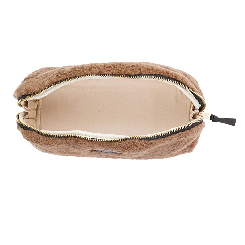 Lovelies Studio _ Wuttu is a mini clutch with a detachable wrist strap and is perfect for carrying your essentials with you. Wuttu is hand made from the finest curly shearling from Australia.   Top zipped closing   Detachable wrist strap   Satin lining and flat zipped inner pocket   Item comes with a branded dust bag.   Embossed Lovelies logo on the front   Gold-toned hardware   Measurements W26 X D2 X H12 cm   100 % Australian curly shearling 
